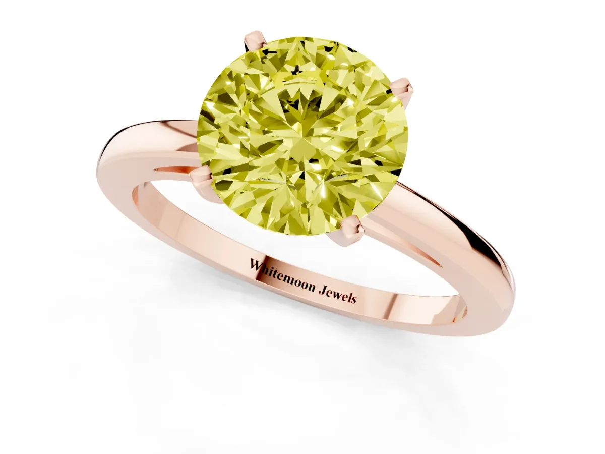 Fancy Yellow Round Cut Solitaire Diamond Engagement Ring with Four-Prong Setting on a Classic Band Rose gold
