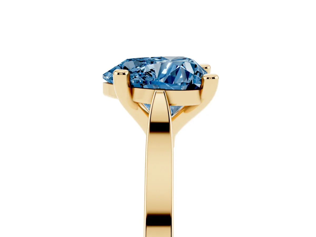 Fancy Blue Heart Cut Solitaire Diamond Ring with Four-Prong Setting and Tapered Band Yellow gold