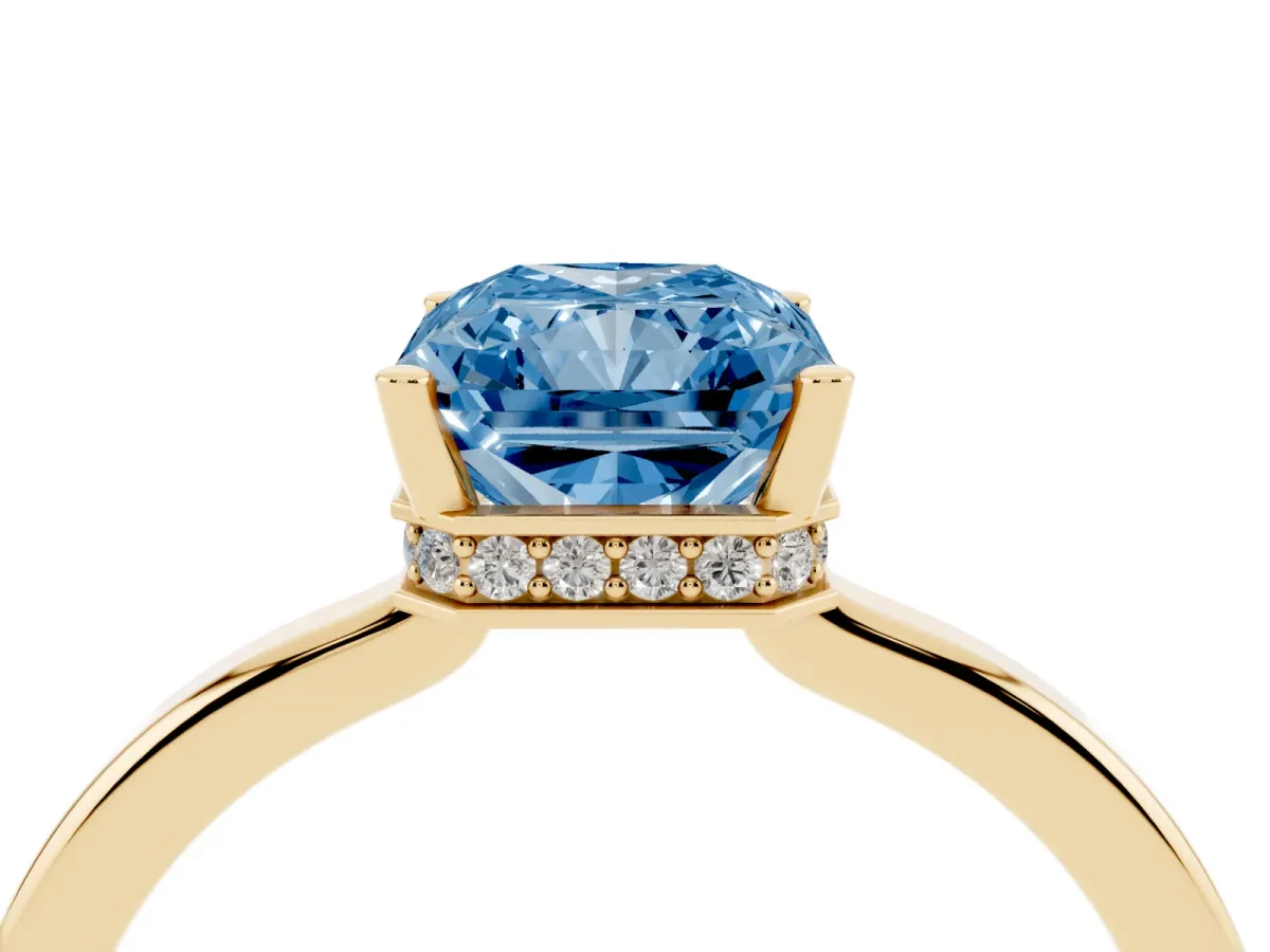 Fancy Blue Radiant Cut Cut Solitaire Engagement Ring with Four-Prong Setting on a Classic Band Yellow gold