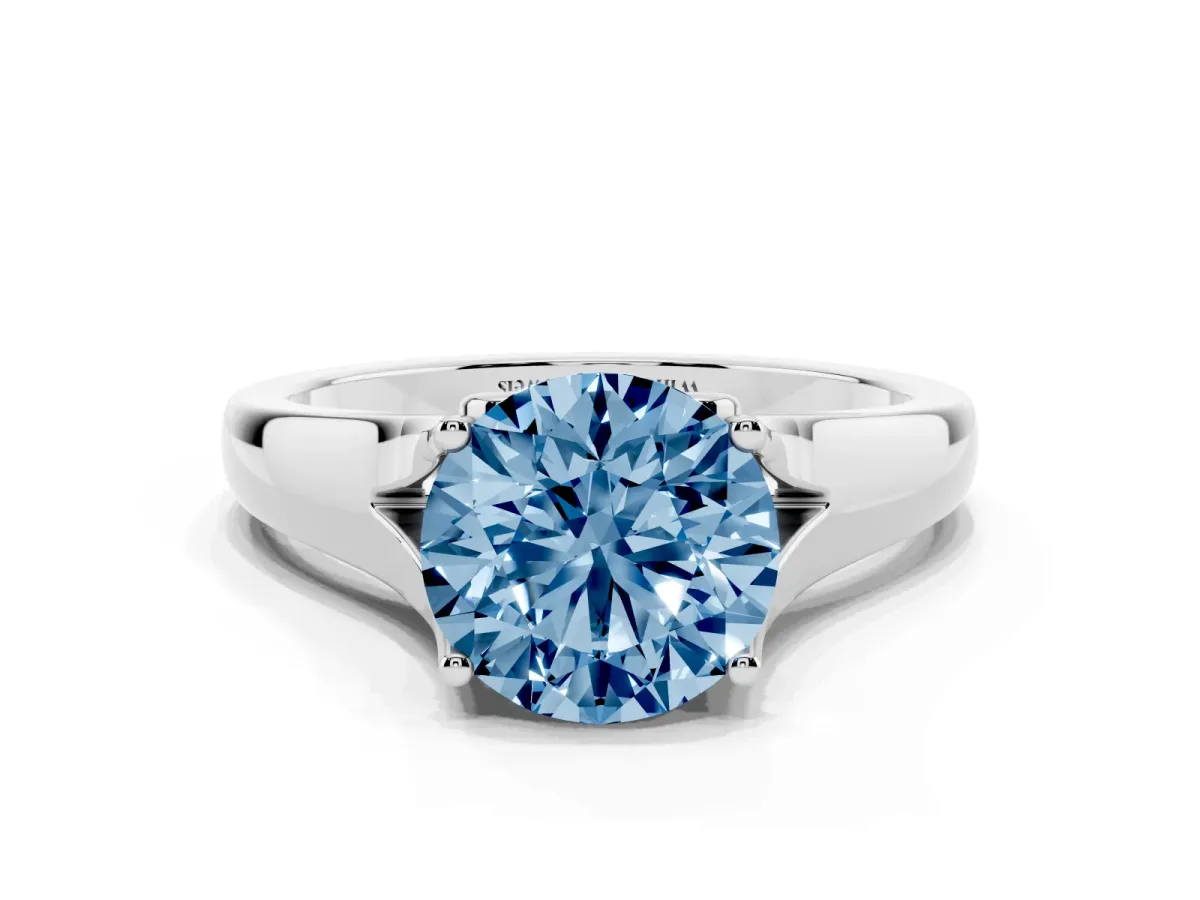 Fancy Blue Round Cut Solitaire Diamond Ring with Cathedral Band and Four-Prong Setting Silver