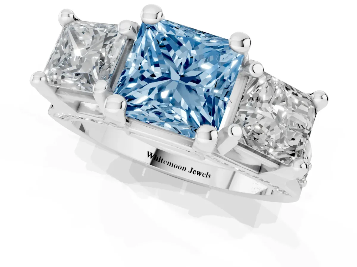 Fancy Blue Princess Cut Diamond Three-Stone Ring with Channel Set Band and Four-Prong Setting Silver