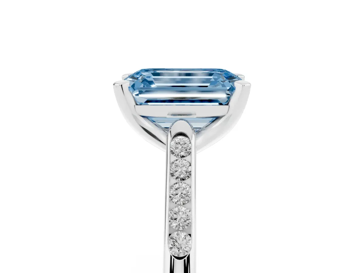 Fancy Blue Emerald Cut Diamond Solitaire Ring with Channel Set Round Band and Prong Setting Silver