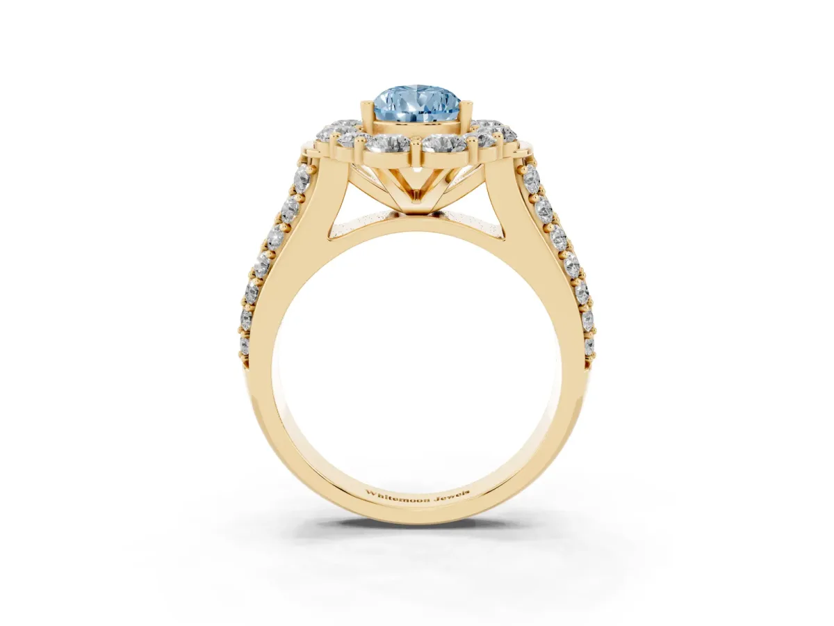 Fancy Blue Pear Cut Halo Diamond Engagement Ring with Split Shank and Prong Setting Yellow gold