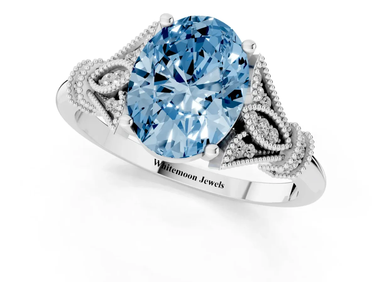 Fancy Blue Oval Cut Diamond Solitaire Ring with Floral Filigree and Pave Accents Silver