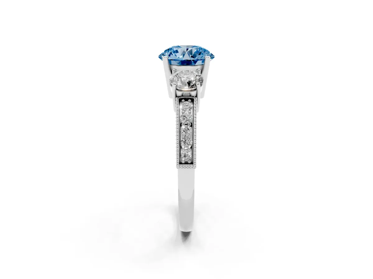 Fancy Blue Round Cut Three-Stone Diamond Ring with Pavé Band and Four-Prong Setting Silver
