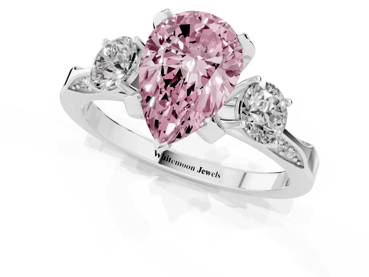 Fancy Pink Pear Cut Brilliant Three-Stone Diamond Ring with Pavé Band and Four-Prong Setting Silver