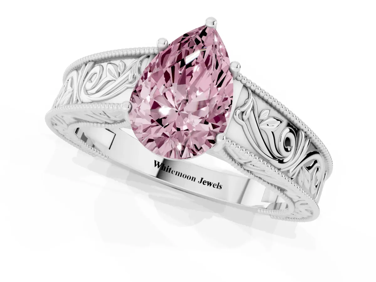 Fancy Pink Pear Cut Diamond Solitaire Ring with Engraved Band and Four-Prong Setting Silver