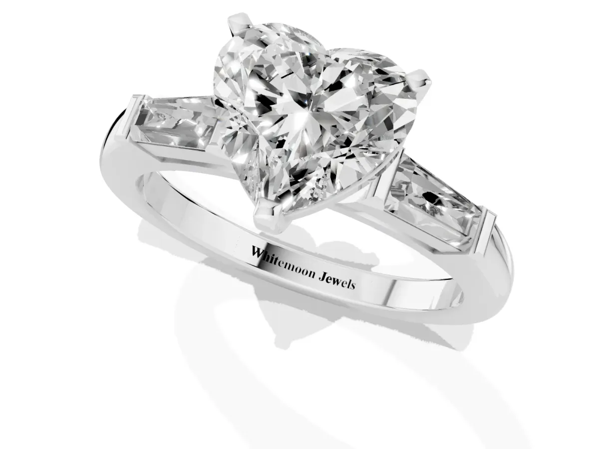 Heart Cut Solitaire with Tapered Baguette Side Stones on a Classic Band with Four-Prong Setting Silver