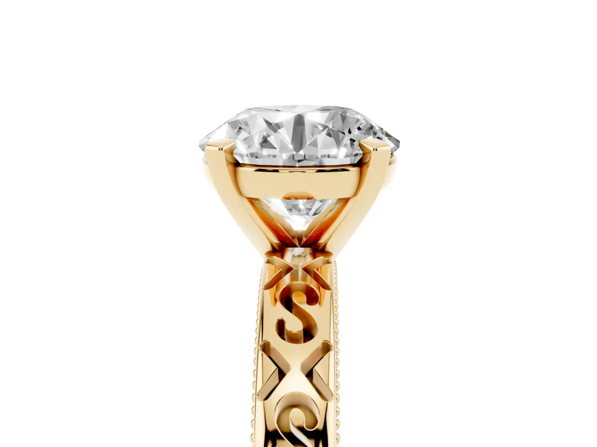 Round Cut Solitaire Engagement Ring with Scrollwork Band and Four-Prong Setting Yellow gold