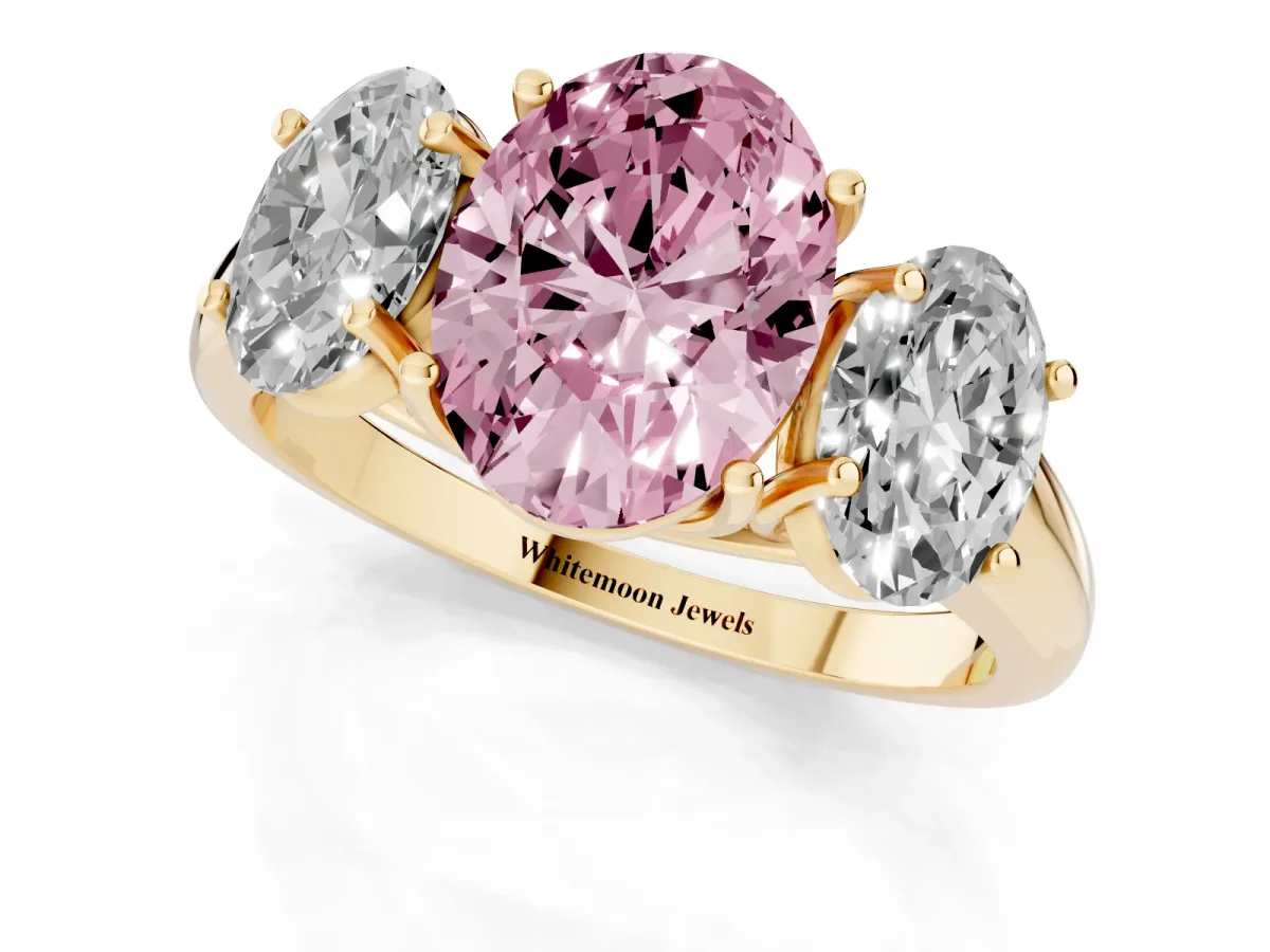 Fancy Pink Three-Stone Oval Cut Diamond Engagement Ring with Prong Setting Yellow gold