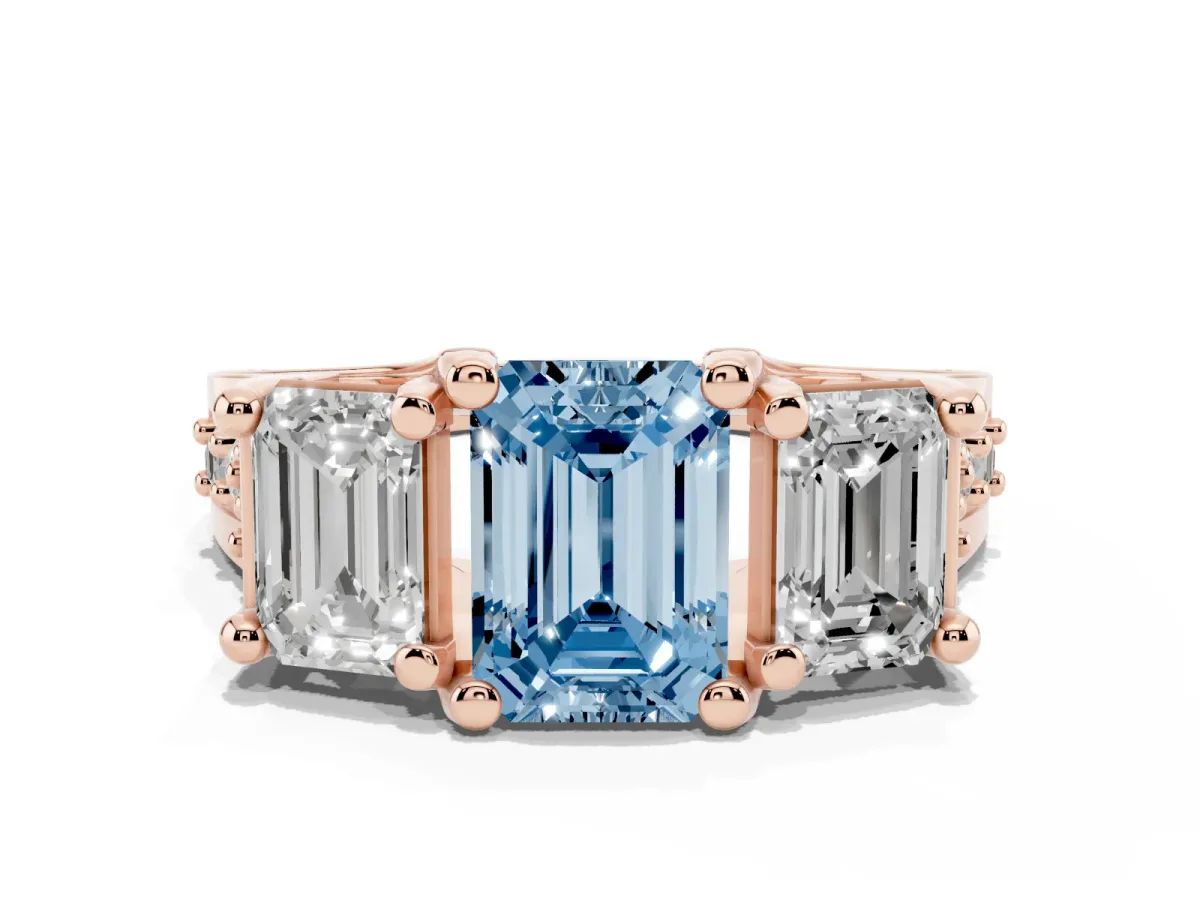 Fancy Blue Emerald Cut Diamond Three-Stone Ring with Channel Set Band and Four-Prong Setting Rose gold
