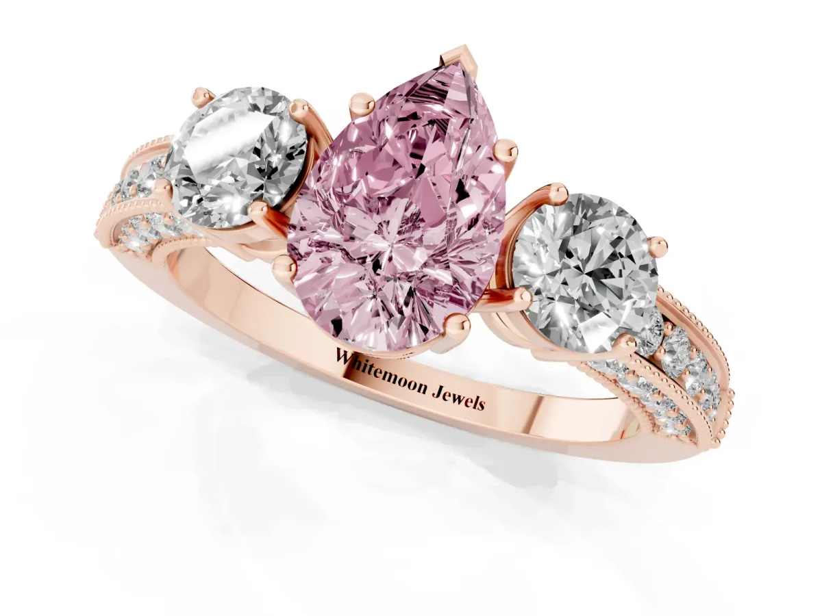Fancy Pink Pear Cut Three-Stone Diamond Ring with Pavé Band and Four-Prong Setting Rose gold