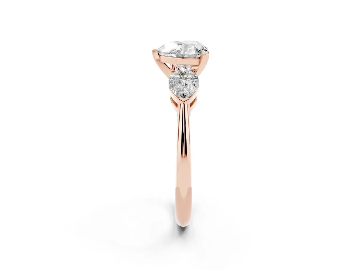 Three-Stone Heart Cut Diamond Ring with Pear Side Stones and Four-Prong Setting Rose gold