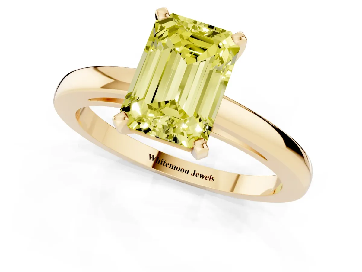 Fancy Yellow Emerald Cut Solitaire Diamond Engagement Ring with Four-Prong Setting on a Classic Band Yellow gold