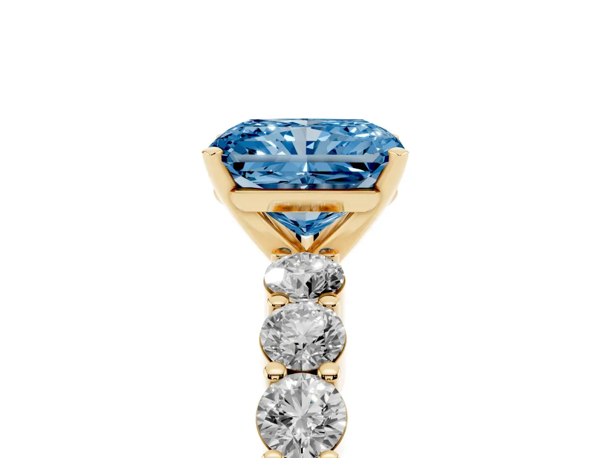 Fancy Blue Radiant Cut Diamond Solitaire Ring with Shared Prong Round Side Stones Yellow gold