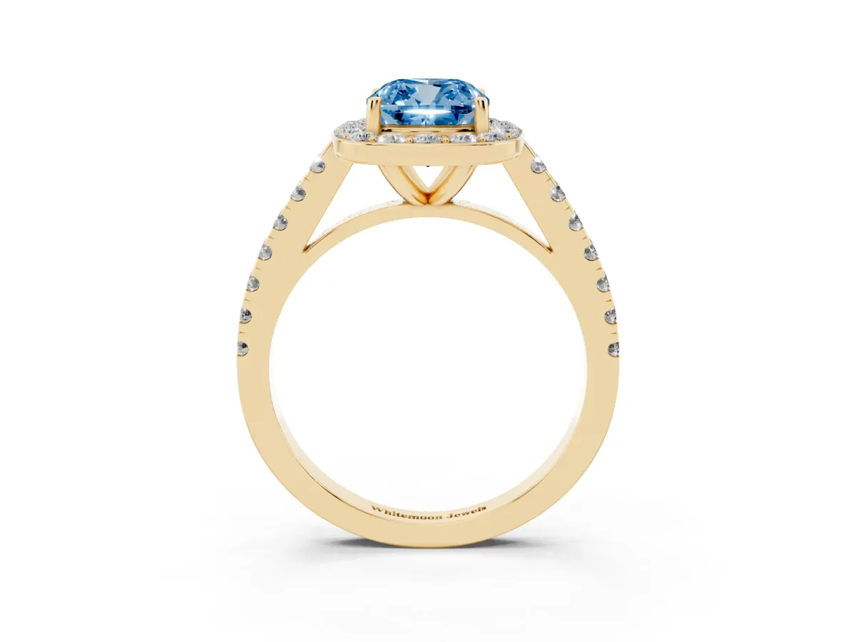 Fancy Blue Cushion Cut Diamond Halo Ring with Round Pavé Split Shank and Prong Setting Yellow gold
