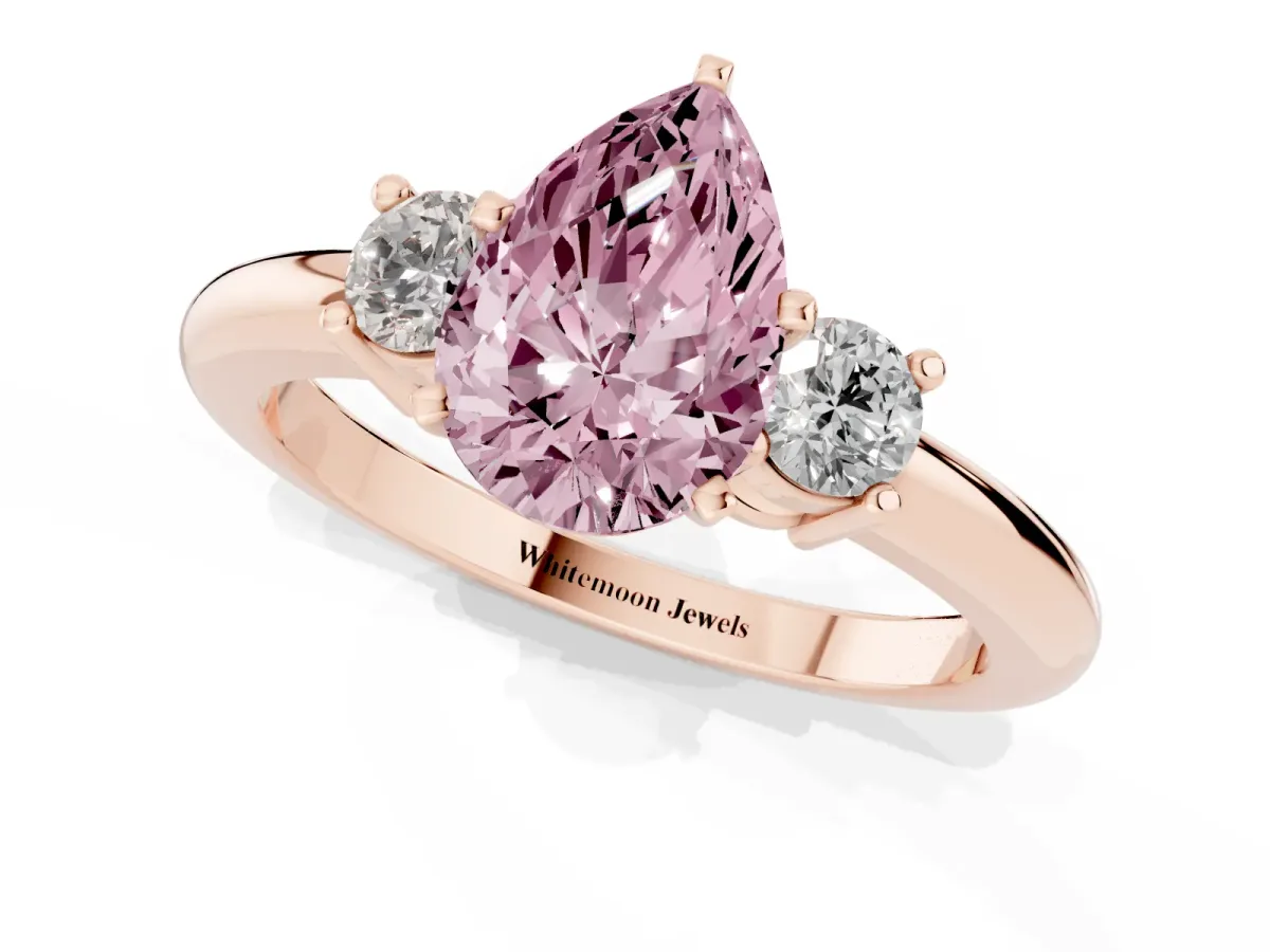 Fancy Pink Three-Stone Pear Cut Cut Diamond Solitaire with Prong Setting and Classic Band Rose gold