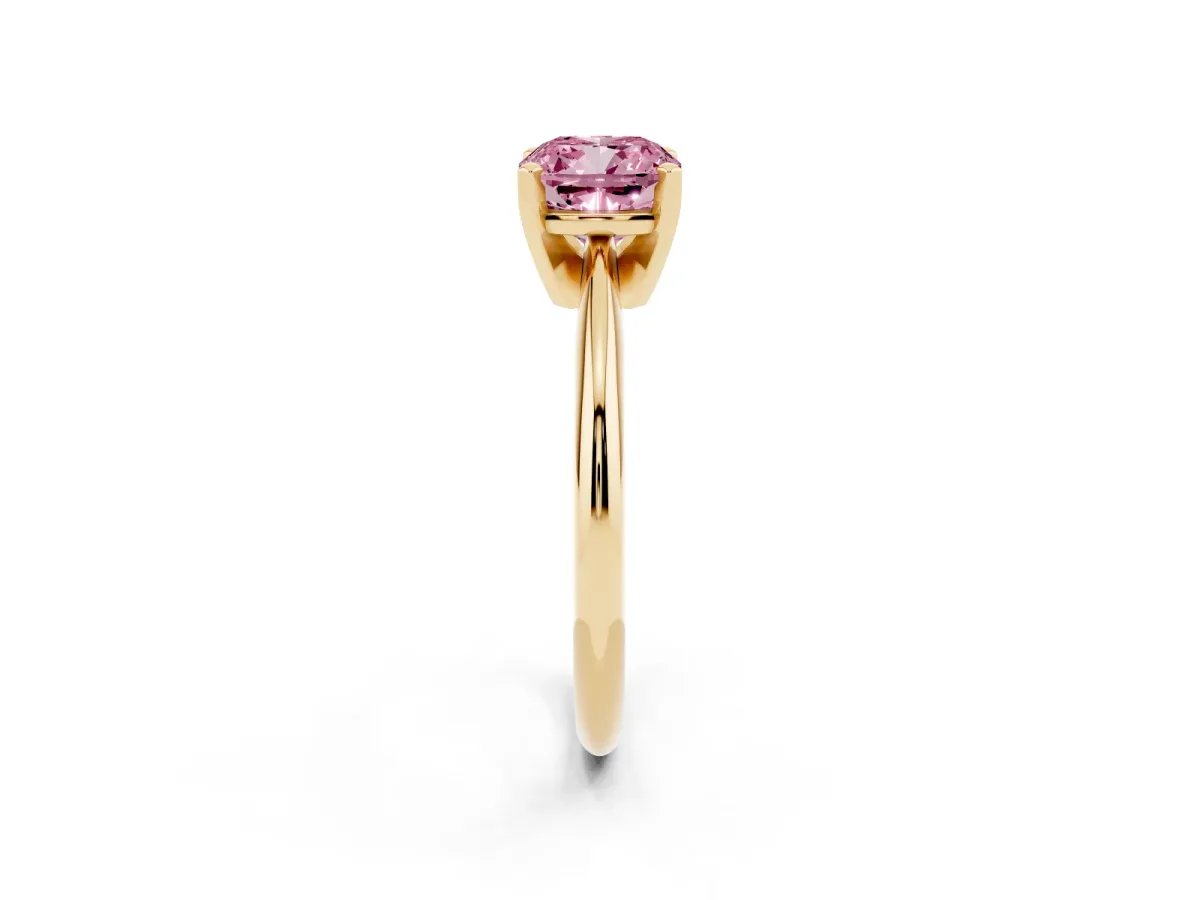 Fancy Pink Cushion Cut Cut Solitaire Ring with Four-Prong Setting on a Classic Band Yellow gold