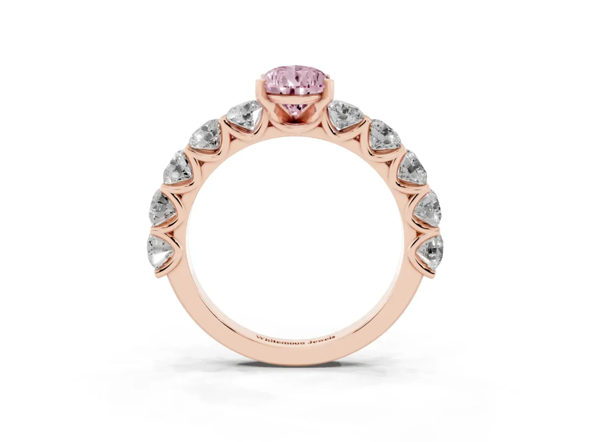 Fancy Pink Pear Cut Diamond Prong Setting with Side Stones on a Pave Band Rose gold