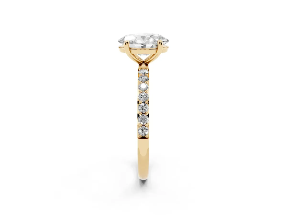 Oval Cut Diamond Solitaire Ring with Round Pavé Band and Prong Setting Yellow gold