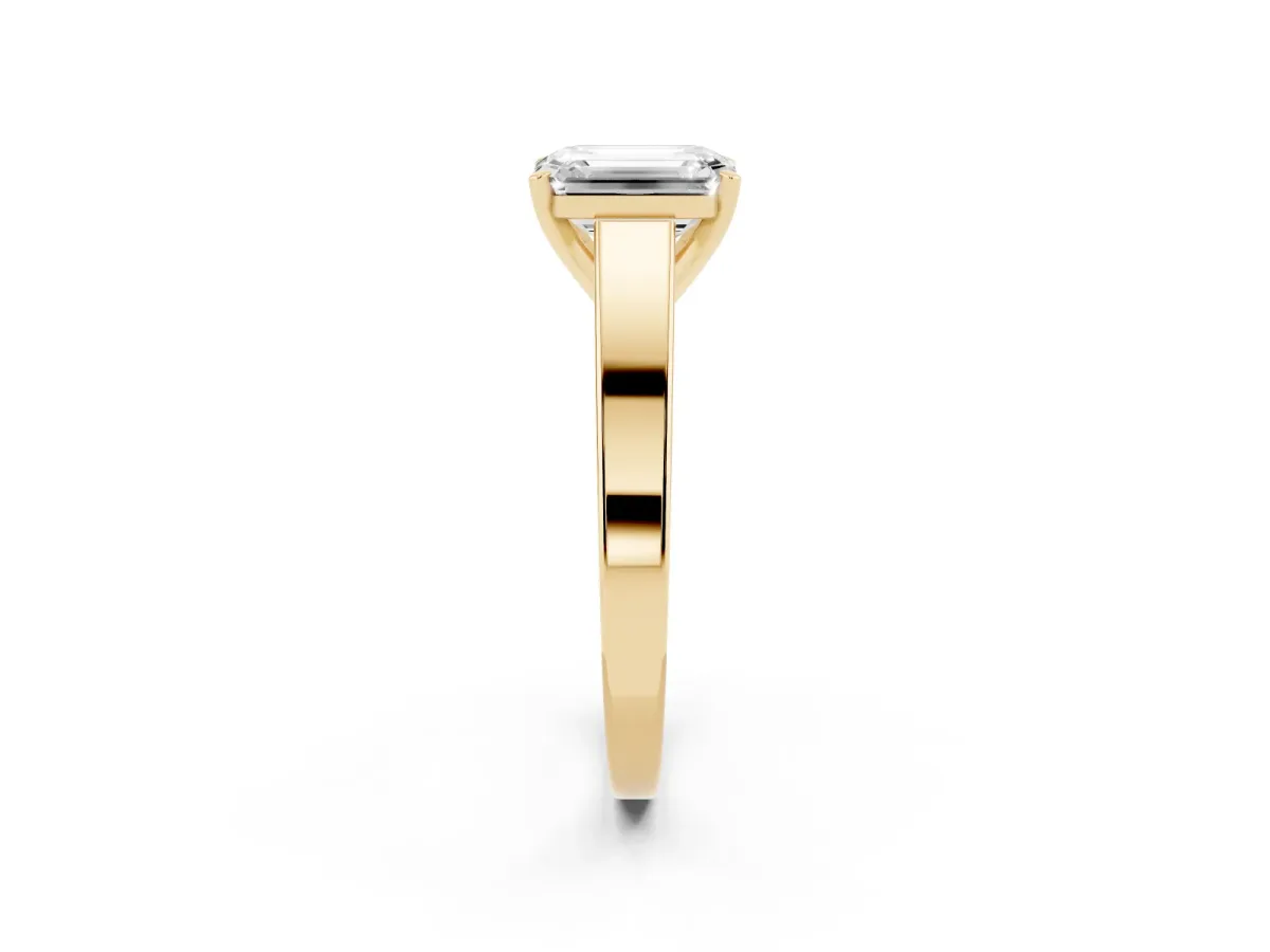Emerald Cut Solitaire Engagement Ring with Four-Prong Setting and Tapered Band Yellow gold