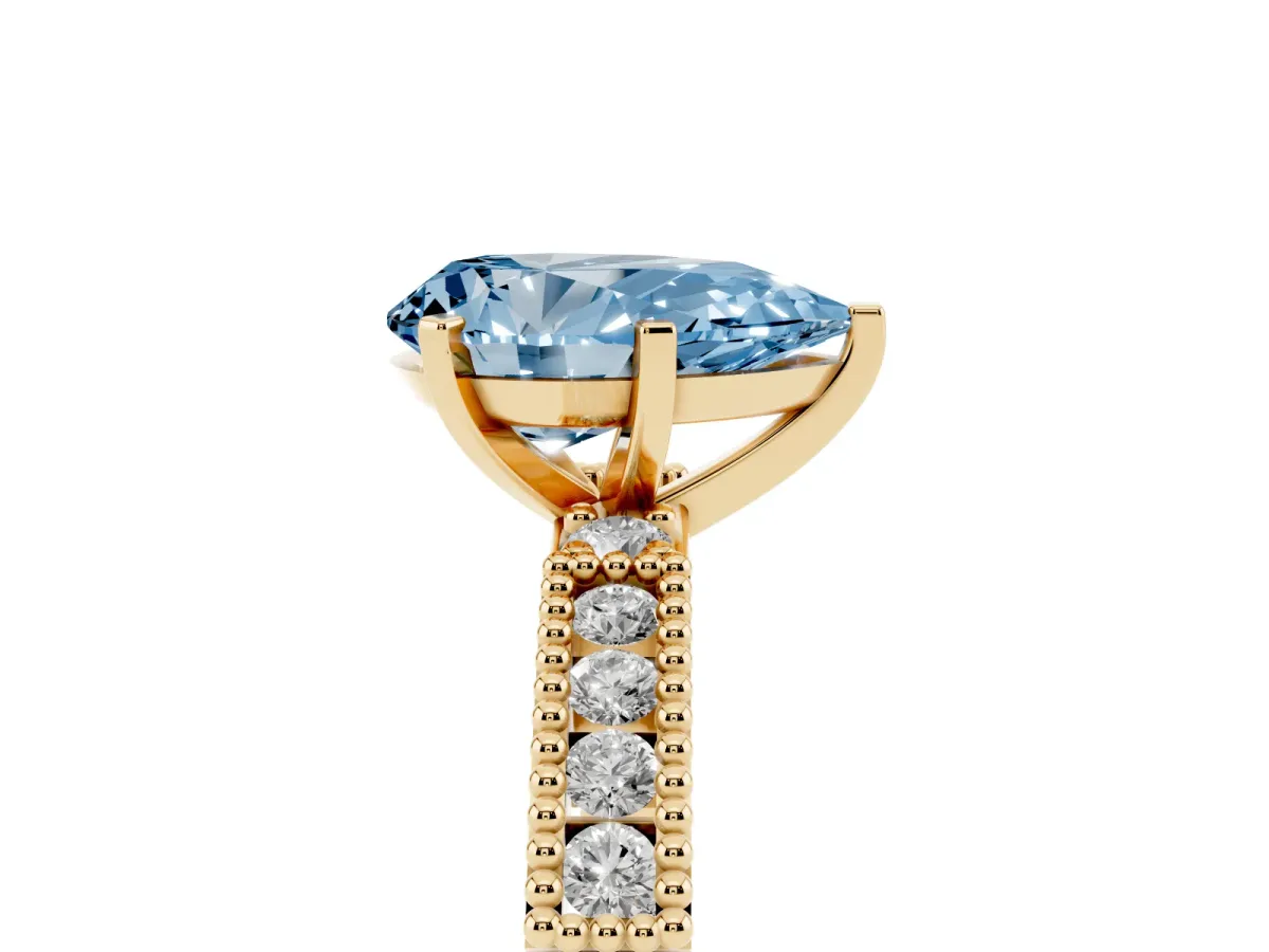 Fancy Blue Pear Cut Solitaire with Pavé Band and Four-Prong Setting Yellow gold