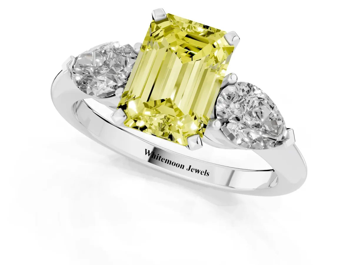 Fancy Yellow Three-Stone Emerald Cut Diamond Ring with Pear Side Stones and Four-Prong Setting Silver
