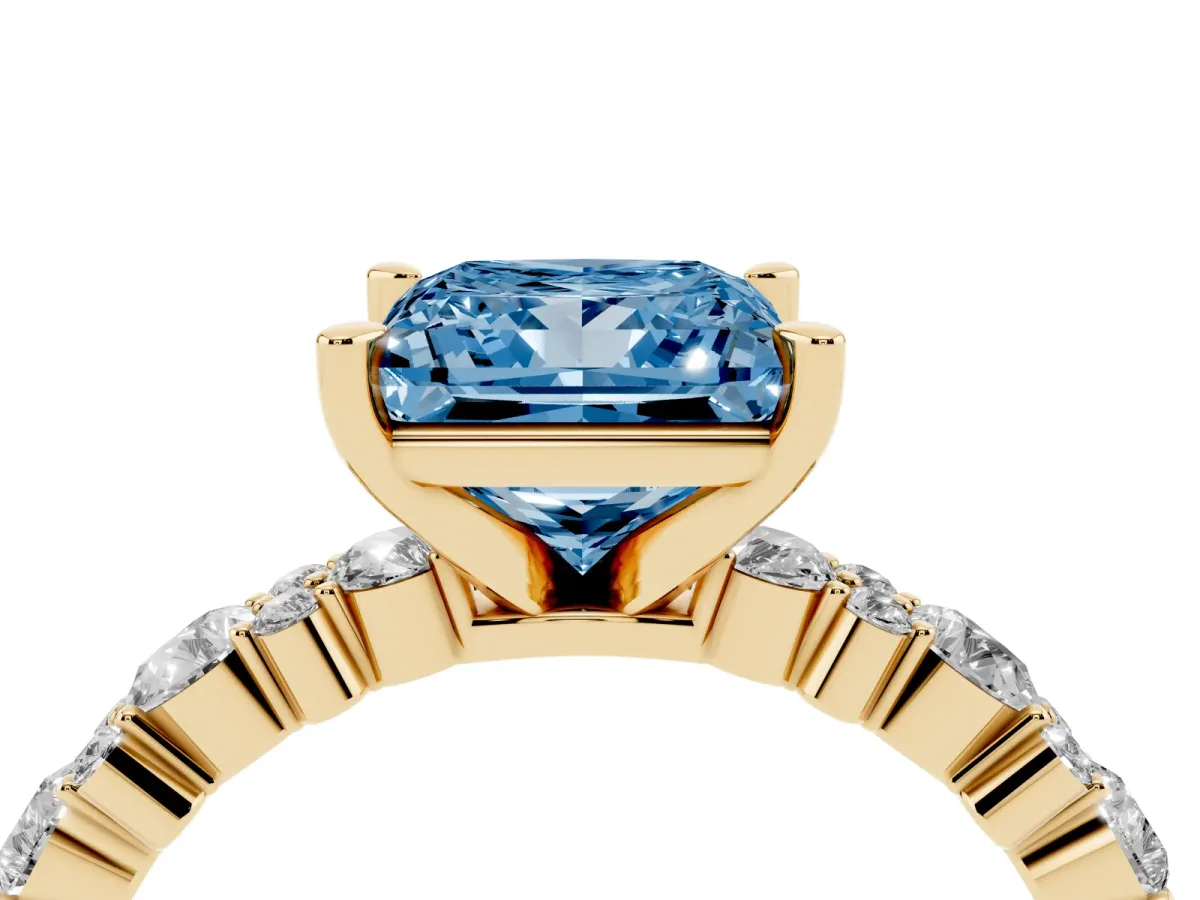 Fancy Blue Princess Cut Diamond Side Stone Solitaire Ring with Round and Four-Prong Setting Yellow gold