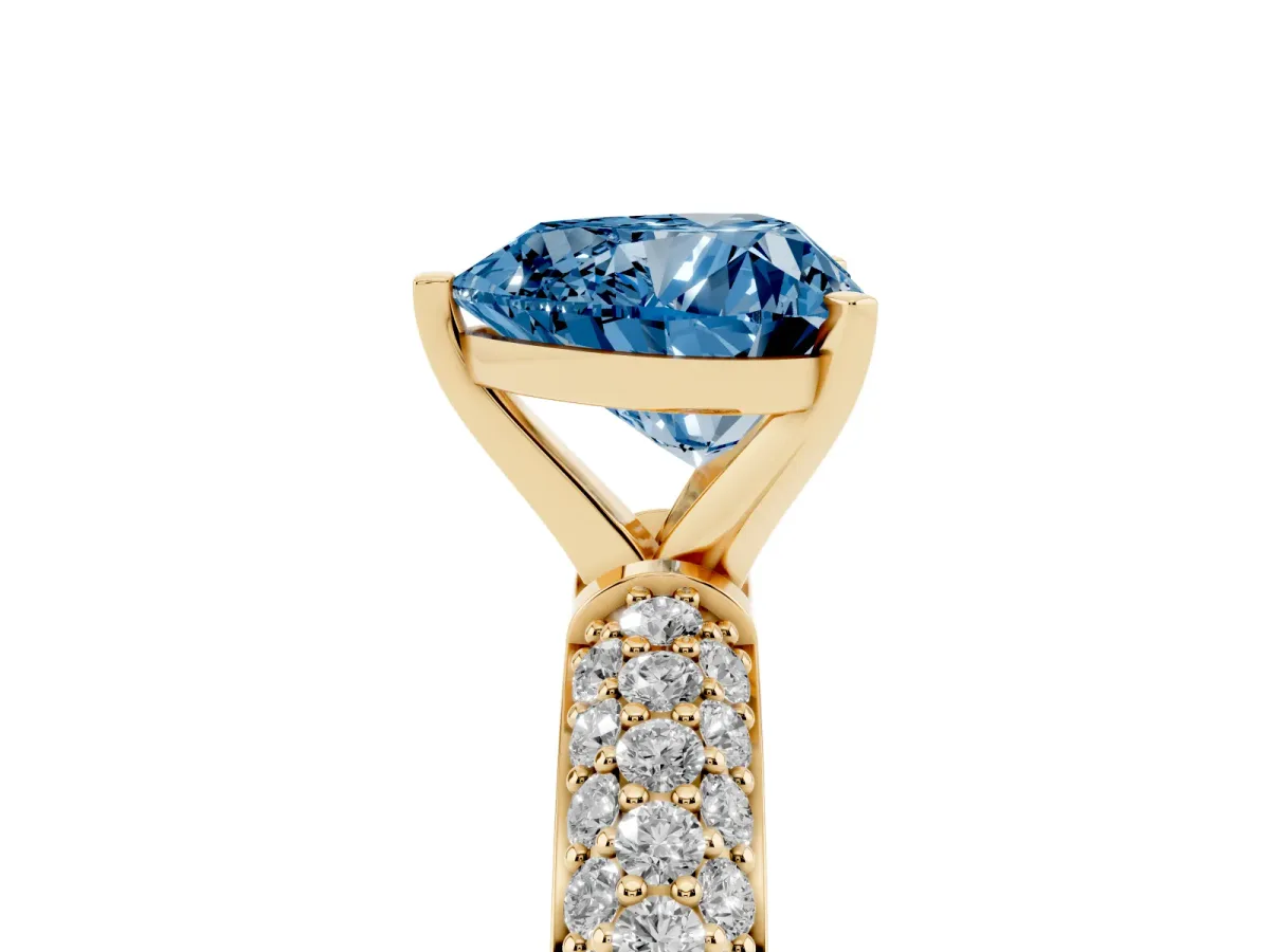 Fancy Blue Heart Cut Diamond Solitaire Ring with Prong Setting and Pavé Band Yellow gold