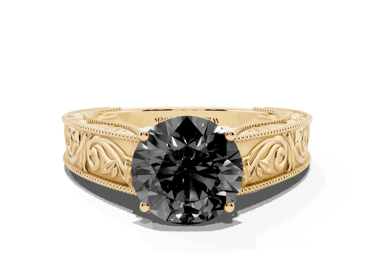 Fancy Black Round Cut Diamond Solitaire Ring with Engraved Band and Four-Prong Setting Yellow gold