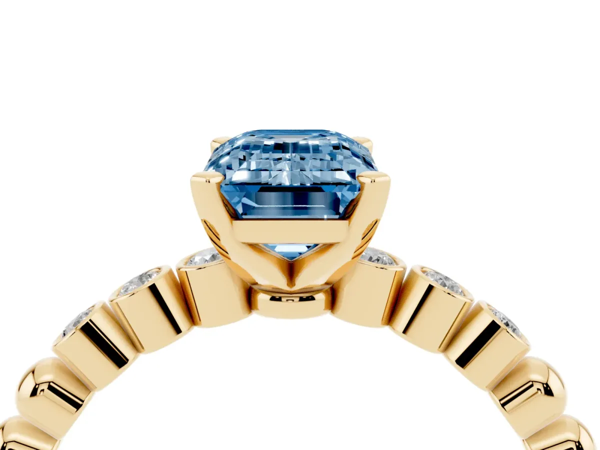 Fancy Blue Emerald Cut Solitaire Bezel Accent Diamond Engagement Ring with Beaded Band and Four-Prong Setting Yellow gold