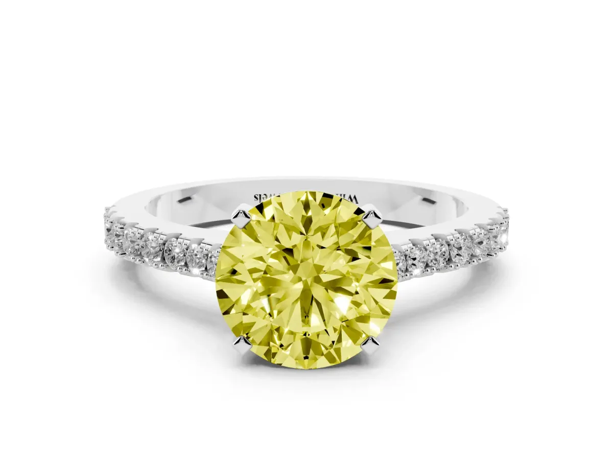 Fancy Yellow Round Cut Cut Solitaire Diamond Engagement Ring with Pave Band and Four-Prong Setting Platinum