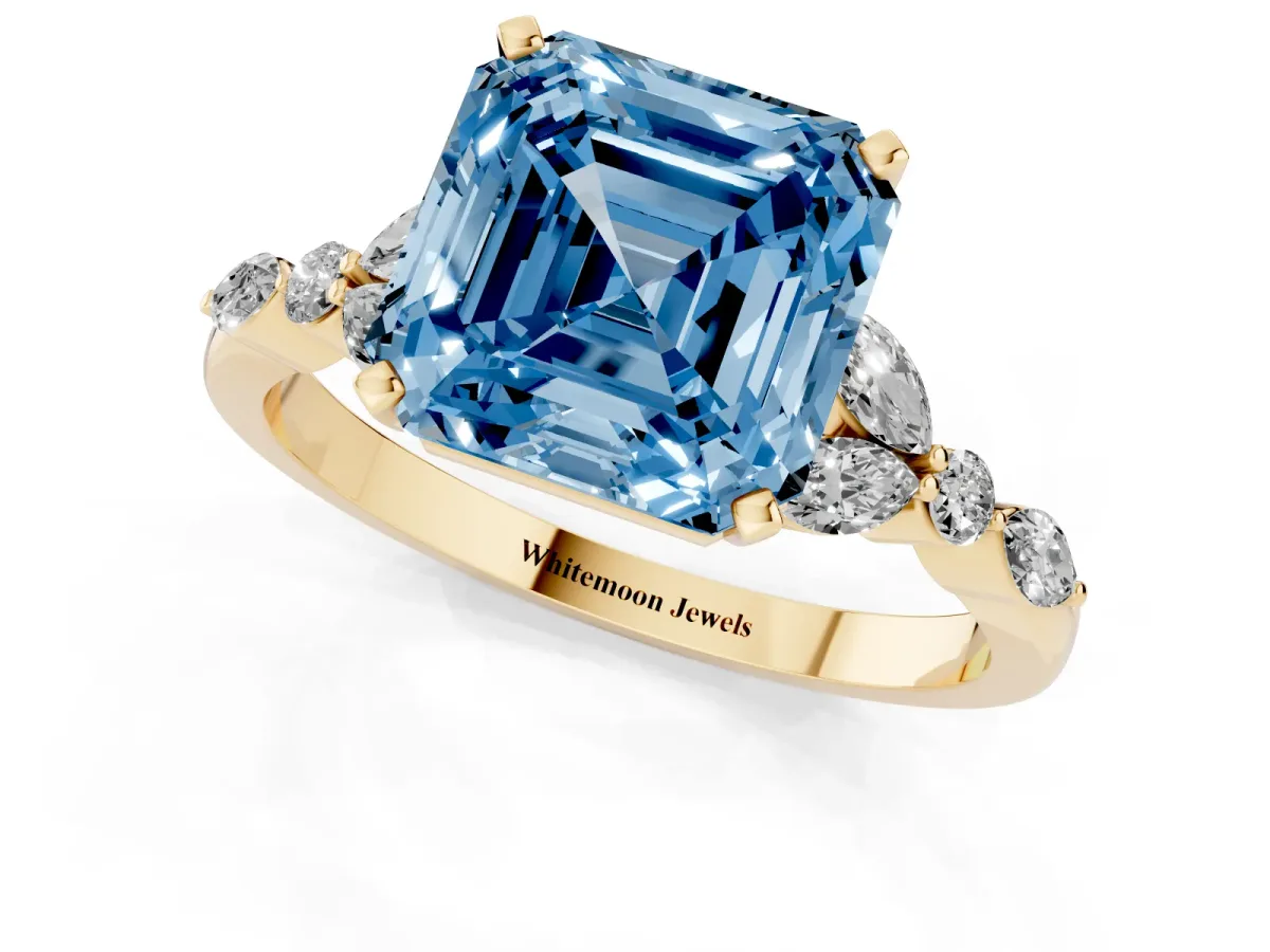 Fancy Blue Asscher Cut Diamond Solitaire Ring with Side Stones and Four-Prong Setting Yellow gold