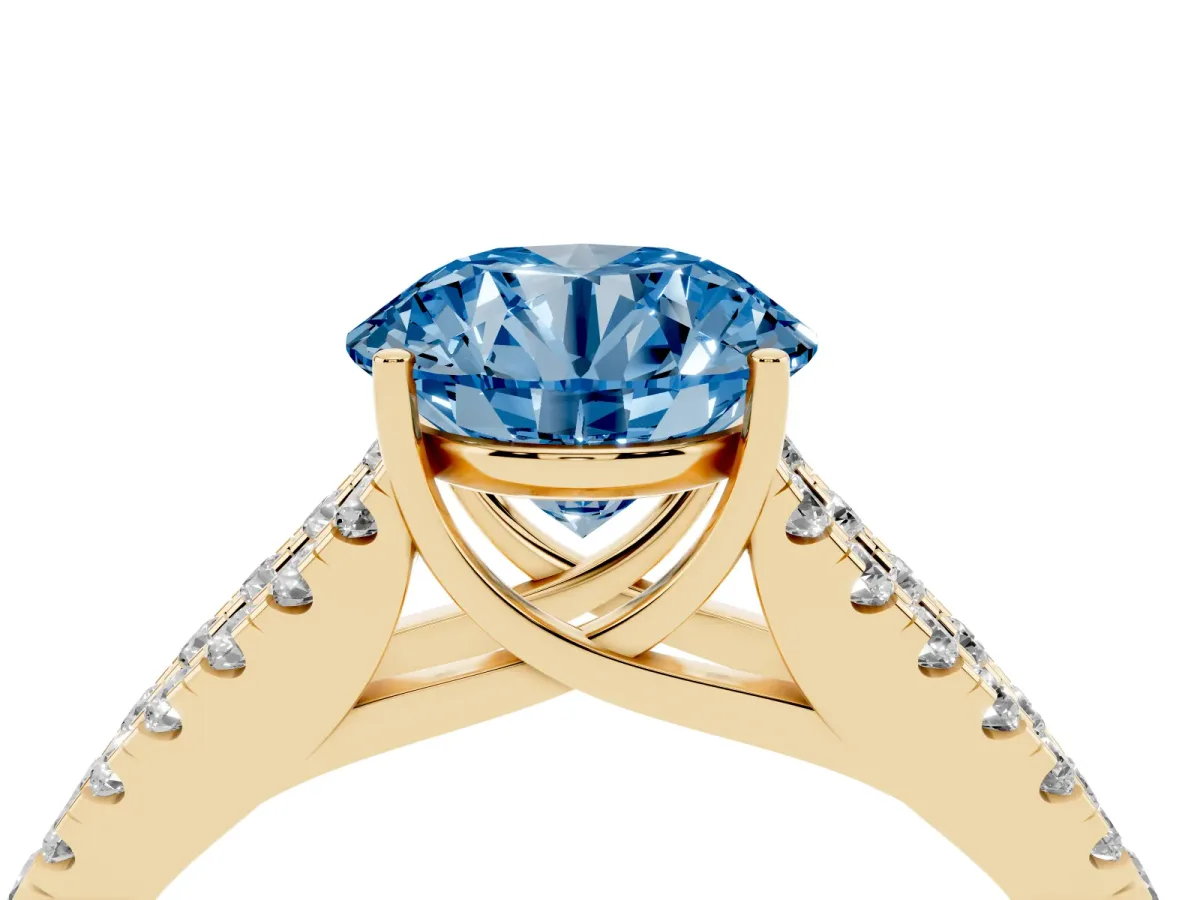 Fancy Blue Round Cut Diamond Split Shank Pavé Engagement Ring with Four-Prong Setting Yellow gold
