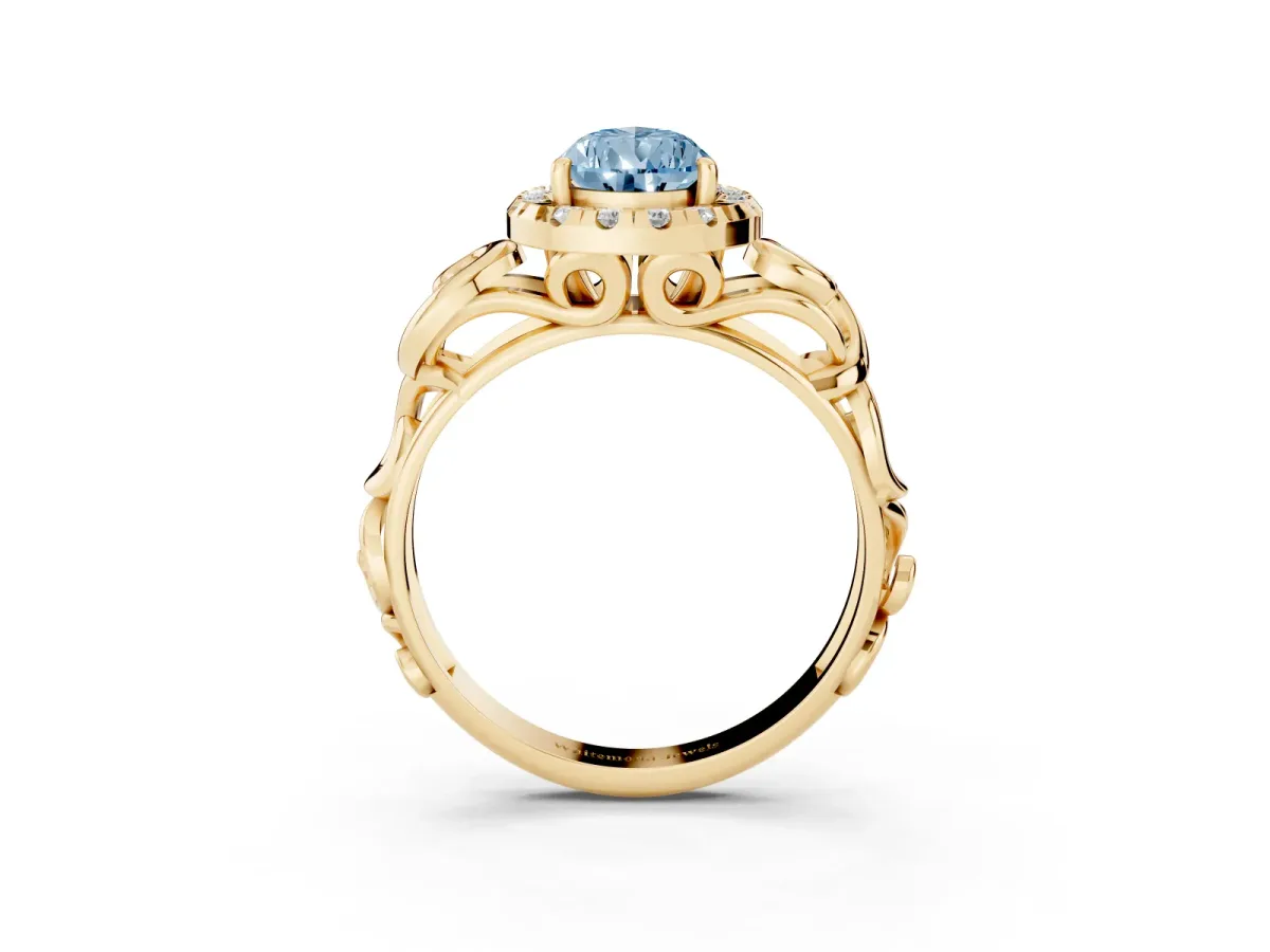 Fancy Blue Pear Cut Cut Halo Diamond Ring with Scrollwork Band and Four-Prong Setting Yellow gold