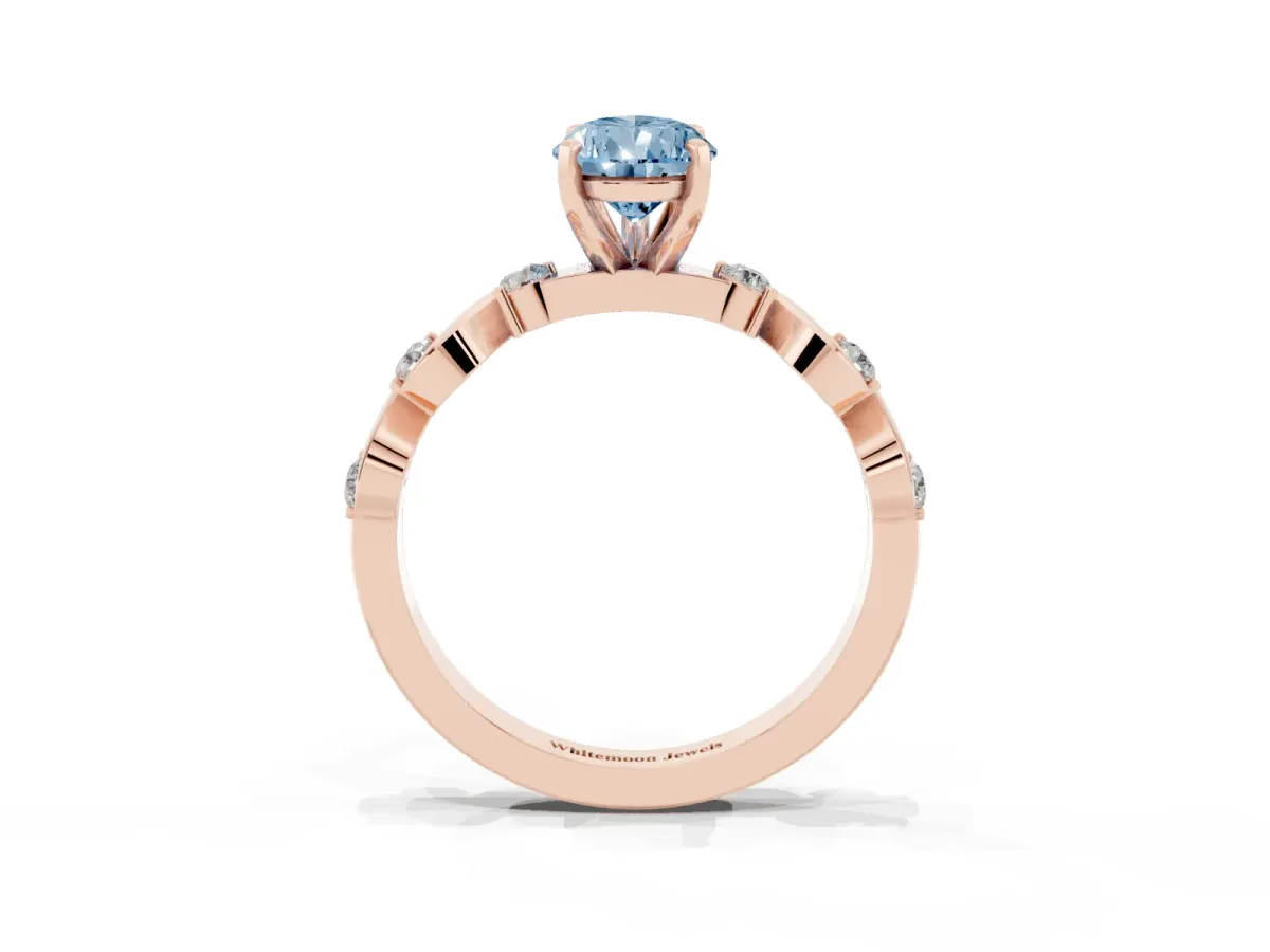 Fancy Blue Pear Cut Diamond Solitaire Twisted Band with Round Accents and Prong Setting Rose gold