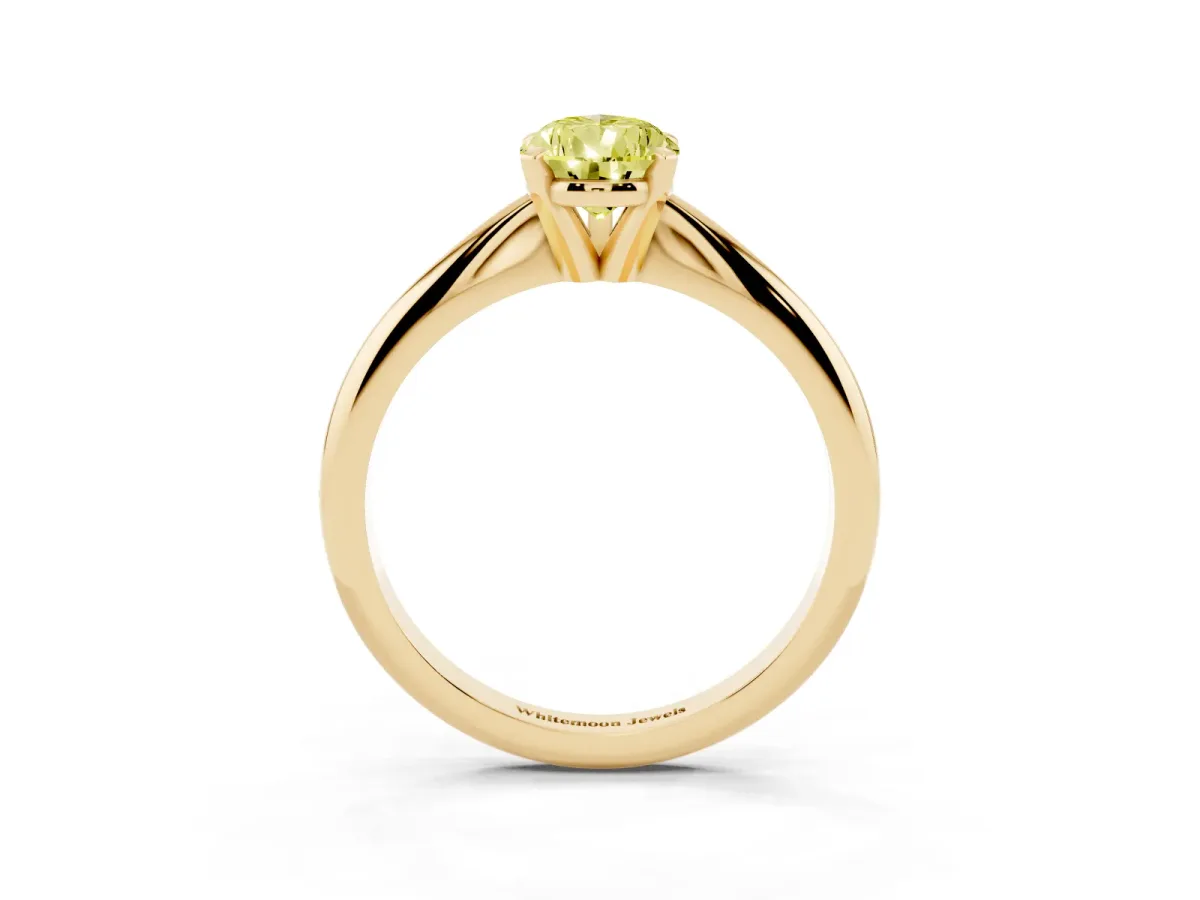 Fancy Yellow Pear Cut Cut Solitaire Ring with Four-Prong Setting on a Classic Band Yellow gold