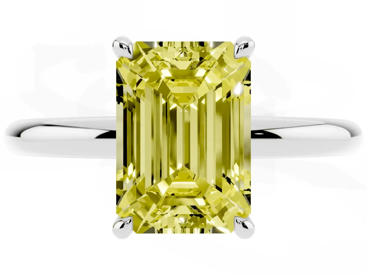 Fancy Yellow Emerald Cut Diamond Solitaire Ring with Thin Band and Four-Prong Setting Silver