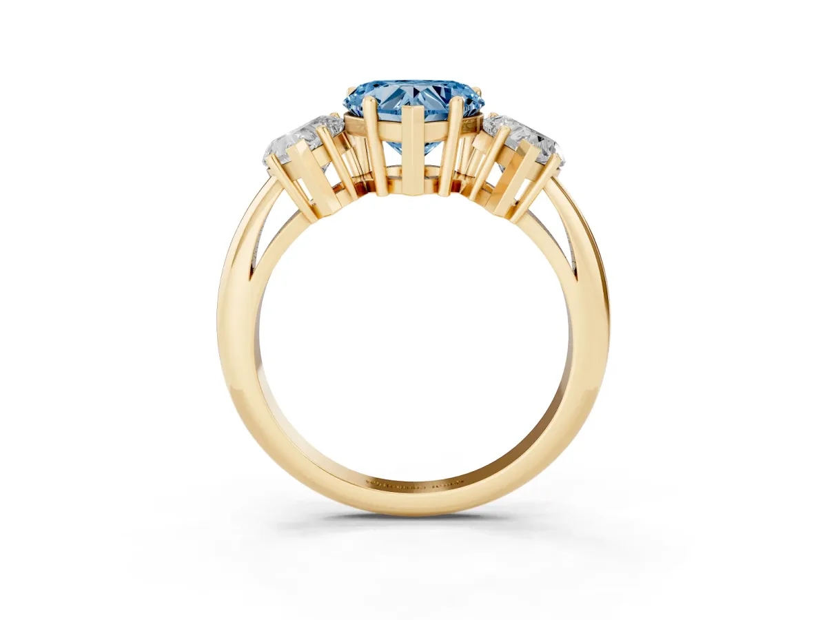 Fancy Blue Three-Stone Heart Cut Cut Diamond Engagement Ring with Prong Setting on a White Gold Band Yellow gold