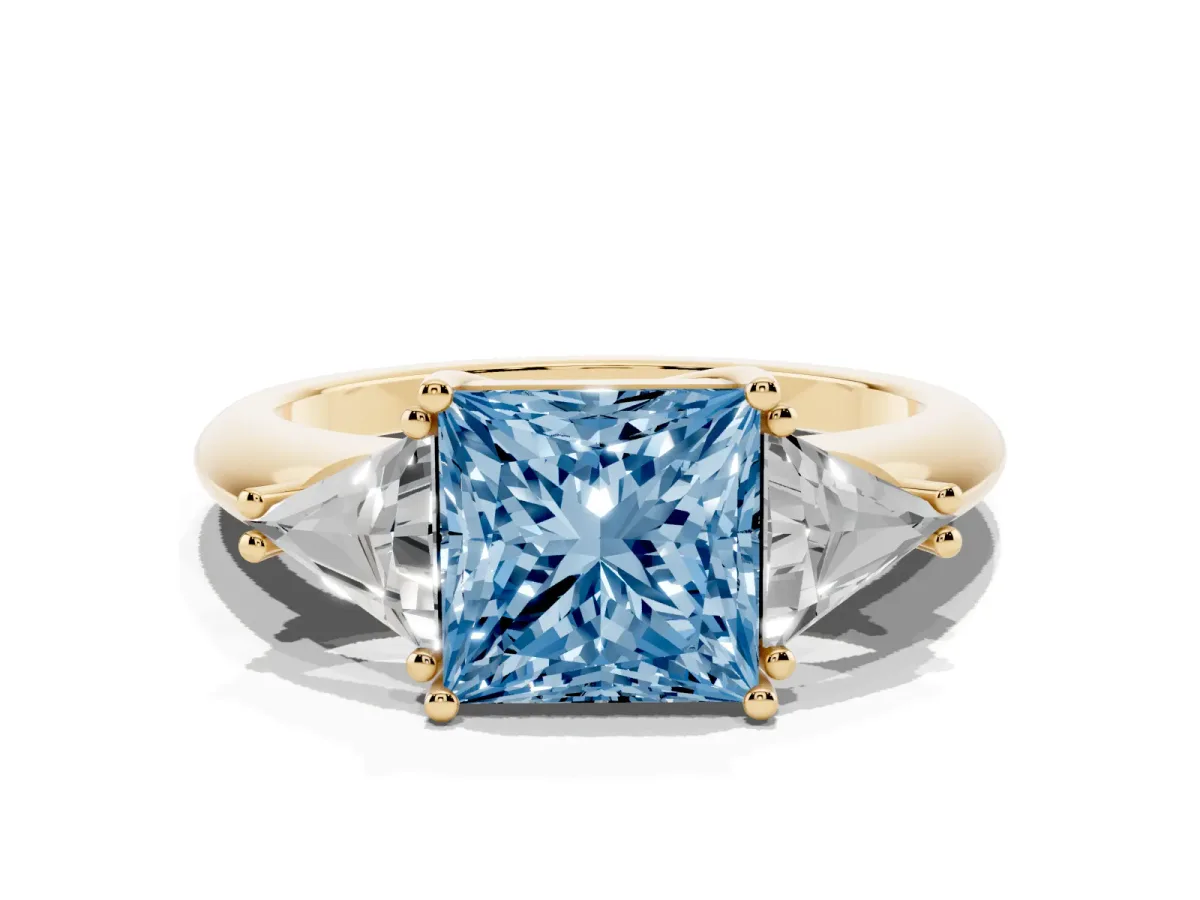 Fancy Blue Three-Stone Princess Cut Diamond Engagement Ring with Trillion Side Stones and Prong Setting Yellow gold