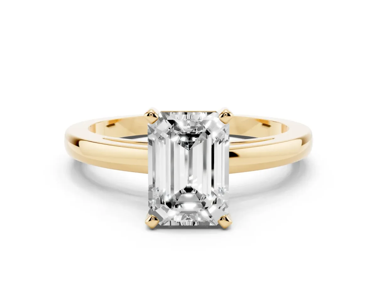 Emerald Cut Solitaire Diamond Engagement Ring with Four-Prong Setting on a Classic Band Yellow gold