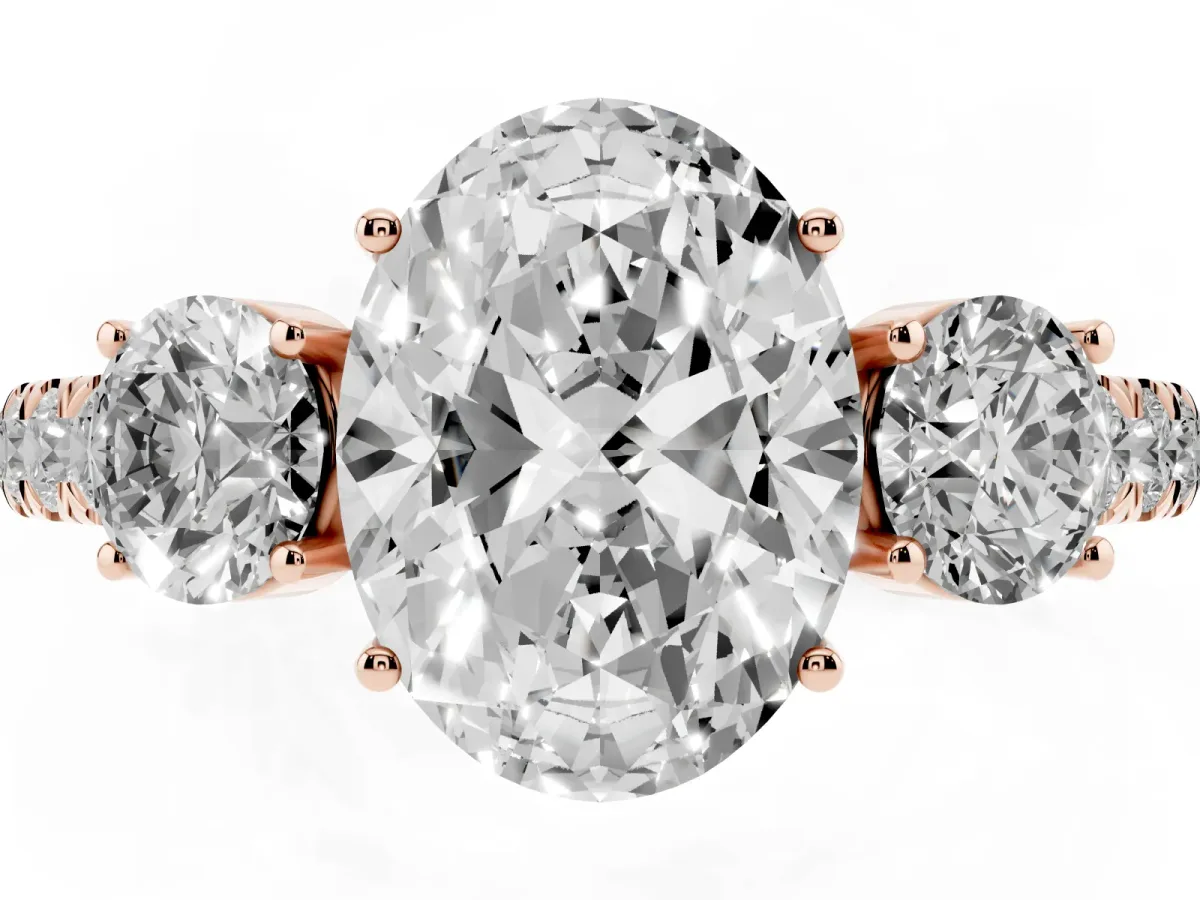 Oval Cut Cut Diamond Three-Stone Ring with Round Side Stones and Pavé Band Rose gold
