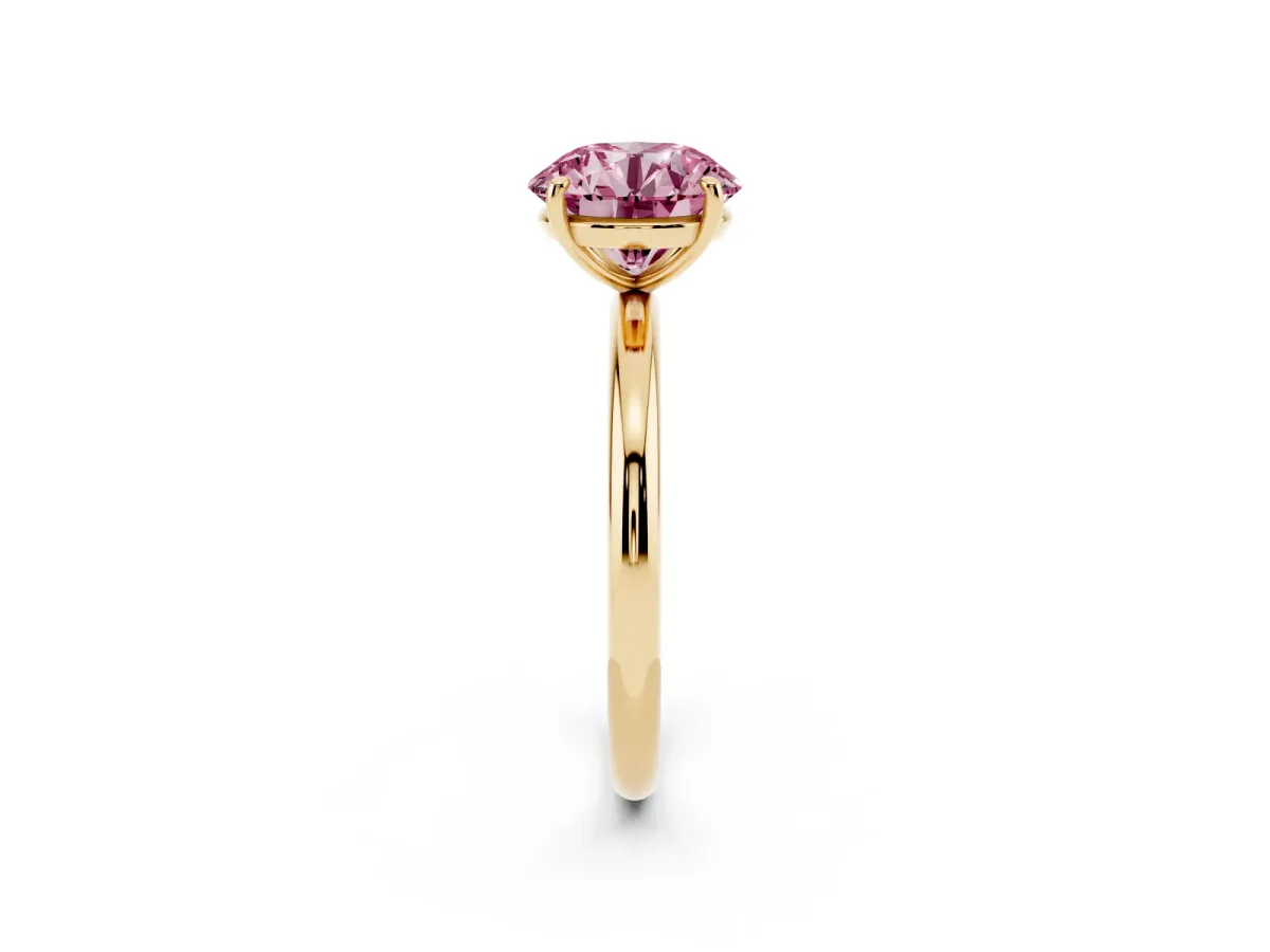 Fancy Pink Round Cut Solitaire Diamond Ring with Four-Prong Setting on a Plain Band Yellow gold
