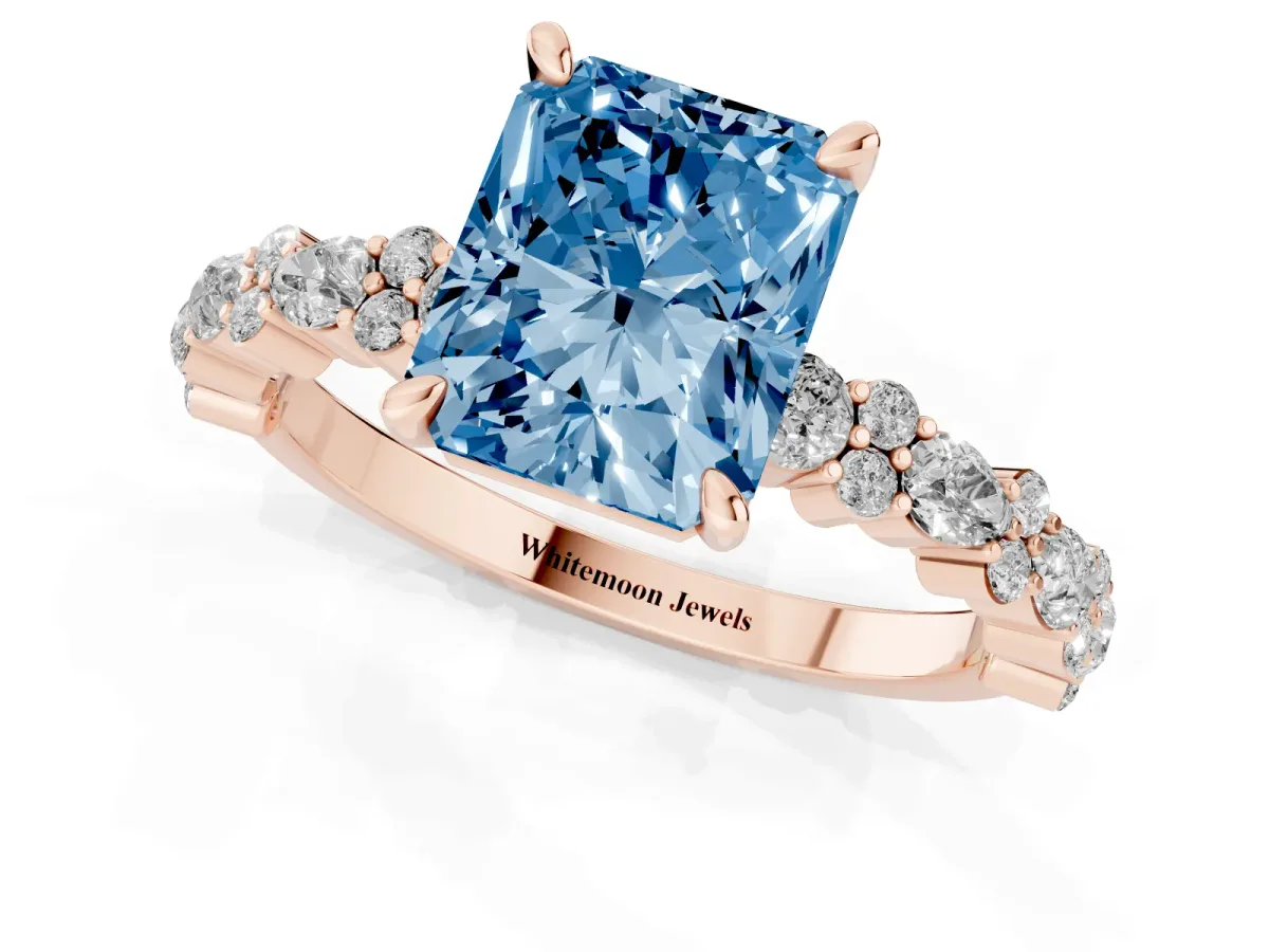Fancy Blue Radiant Cut Diamond Side Stone Solitaire Ring with Round and Four-Prong Setting Rose gold