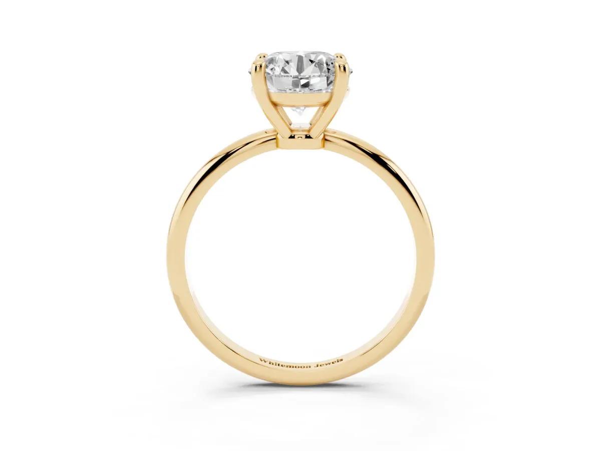 Round Cut Solitaire Diamond Ring with 4-Prong Setting on a Classic Band Yellow gold