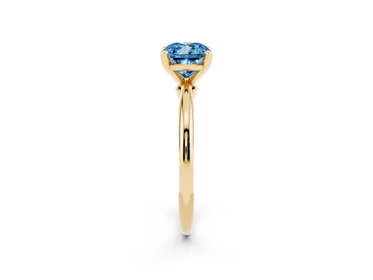 Fancy Blue Cushion Cut Diamond Solitaire Ring with Prong Setting and Classic Band Yellow gold