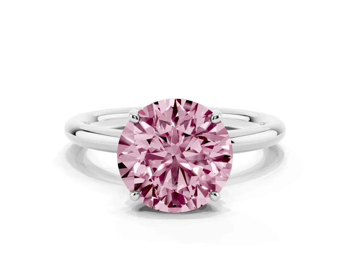 Fancy Pink Round Cut Solitaire Diamond Ring with Four-Prong Setting on a Plain Band Platinum