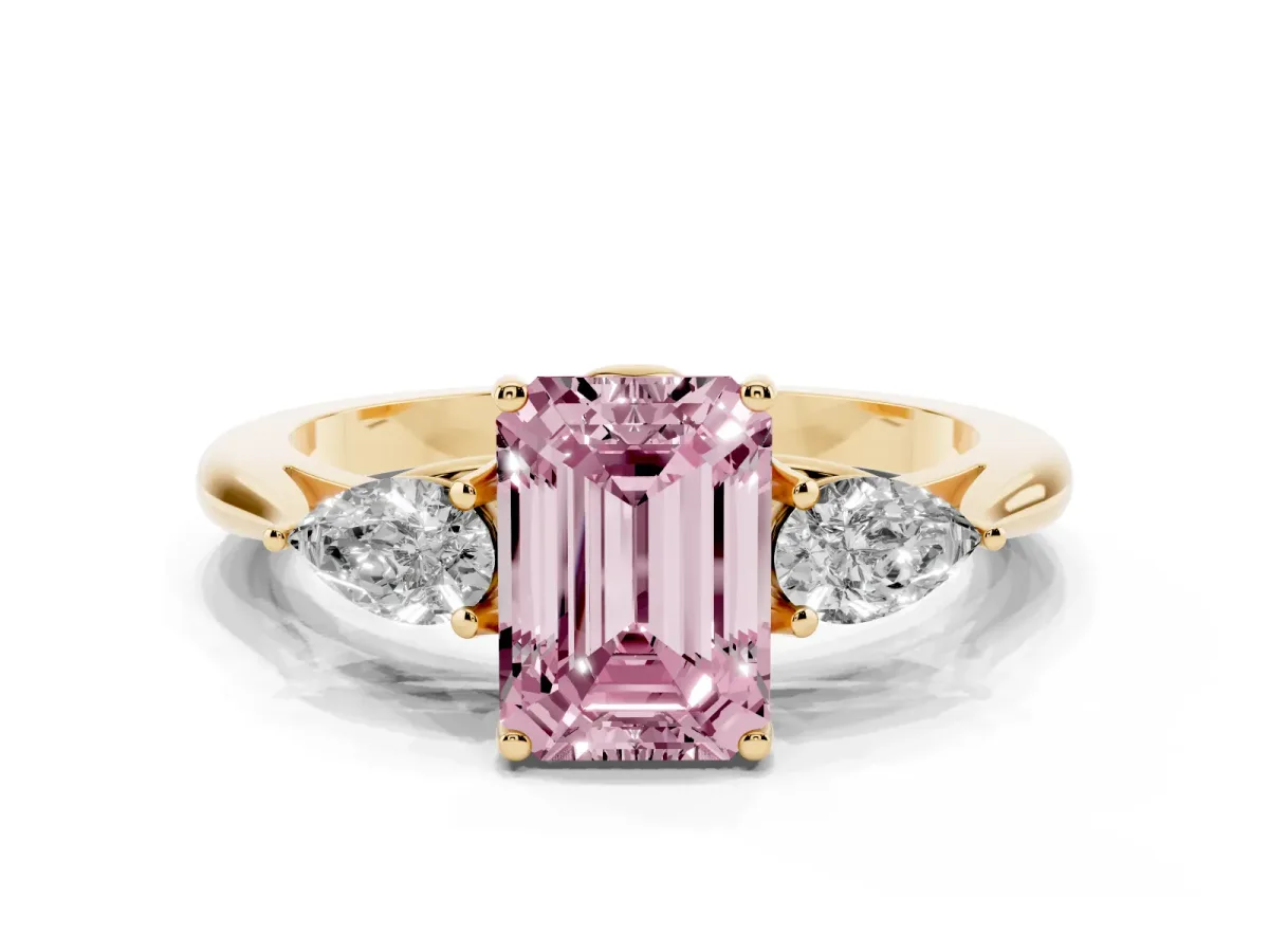 Fancy Pink Three-Stone Emerald Cut Diamond Ring with Pear Side Stones in Four-Prong Setting Yellow gold