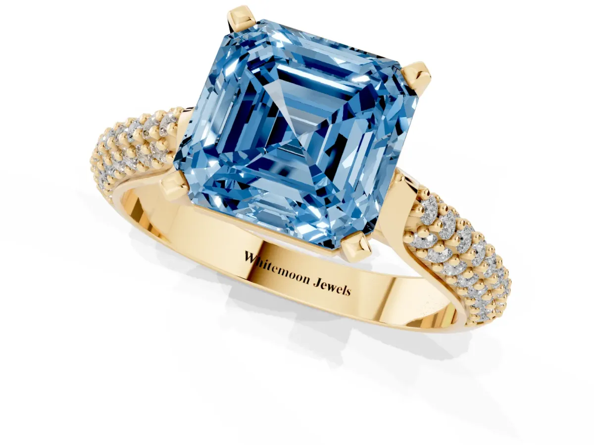 Fancy Blue Asscher Cut Diamond Solitaire Engagement Ring with Multi-Row Round Pavé Band and Prong Setting Yellow gold