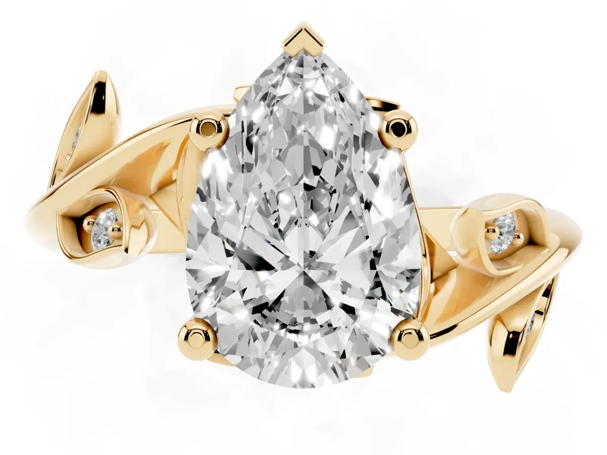 Pear Cut Solitaire Twist Engagement Ring with Leaf Accents and Prong Setting Yellow gold